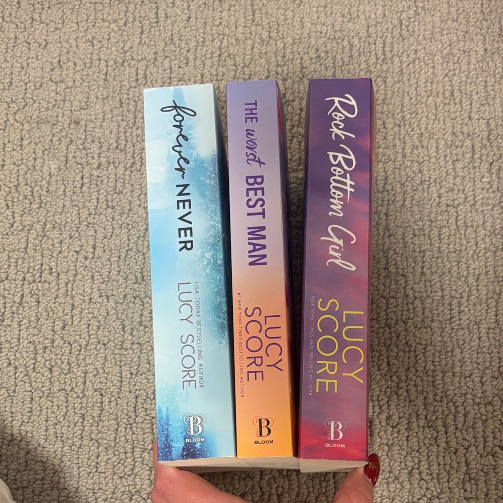 Bloom Lucy Score Book Trio with Blue, Purple, and Pink Covers